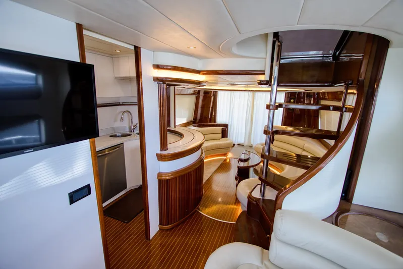 Julia Too Yacht Photos Pics Luxurious interior of 2002 Azimut 70 Sea Jet yacht with elegant wood finishes.