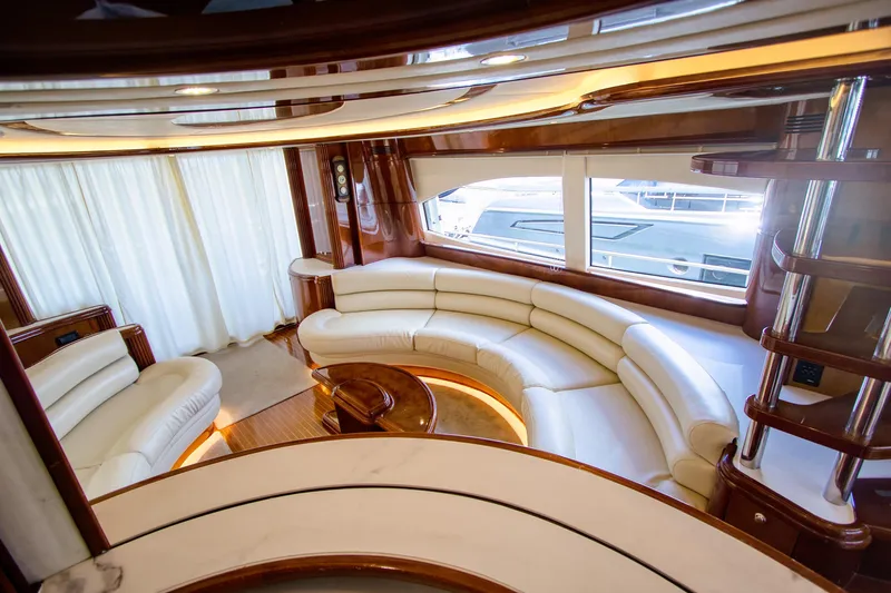 Julia Too Yacht Photos Pics Luxurious interior of 2002 Azimut 70 Sea Jet yacht with elegant white seating.