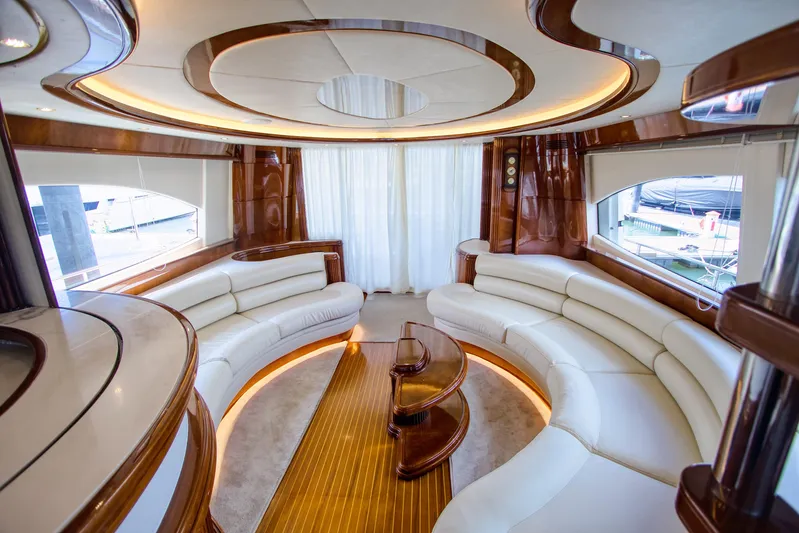 Julia Too Yacht Photos Pics Luxurious interior of a 2002 Azimut 70 Sea Jet yacht with elegant seating.