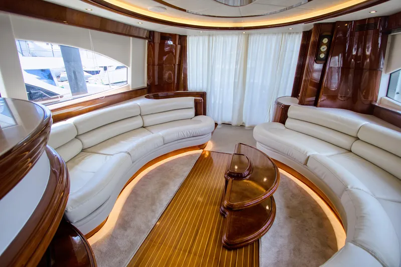 Julia Too Yacht Photos Pics Luxurious interior of 2002 Azimut 70 Sea Jet yacht with elegant white seating.