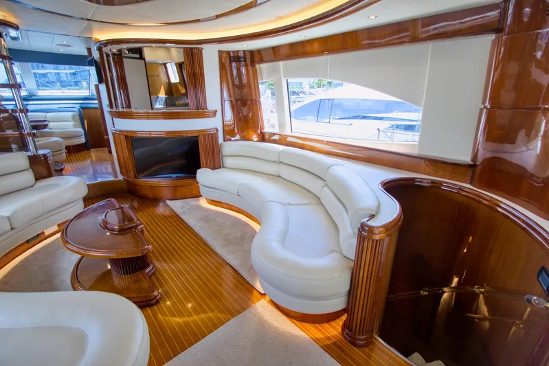 Julia Too Yacht Photos Pics Luxurious interior of a 2002 Azimut 70 Sea Jet yacht with elegant wood and leather furnishings.
