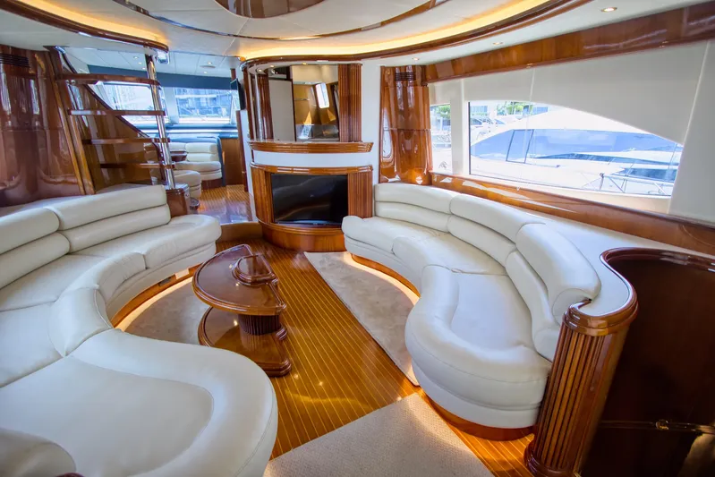 Julia Too Yacht Photos Pics Luxurious interior of a 2002 Azimut 70 Sea Jet yacht with elegant seating and wood finishes.