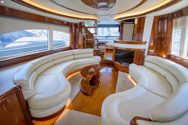 Julia Too Yacht Photos Pics Luxurious interior of a 2002 Azimut 70 Sea Jet yacht with elegant seating and wood finishes.