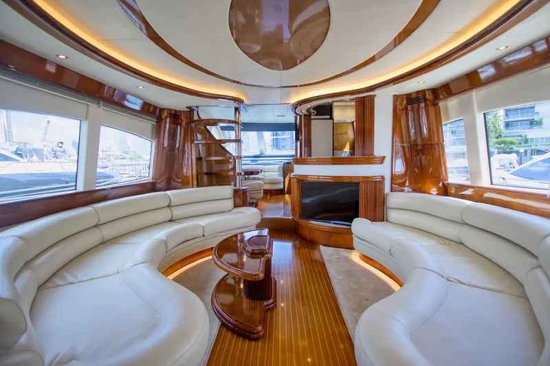 Julia Too Yacht Photos Pics Luxurious interior of 2002 Azimut 70 Sea Jet yacht with elegant seating and wood finishes.