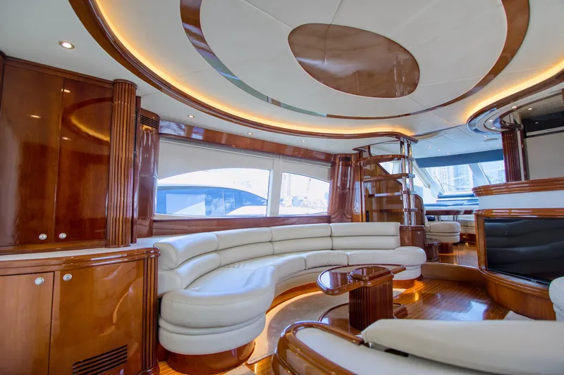 Julia Too Yacht Photos Pics Luxurious interior of a 2002 Azimut 70 Sea Jet yacht with elegant wood finishes.