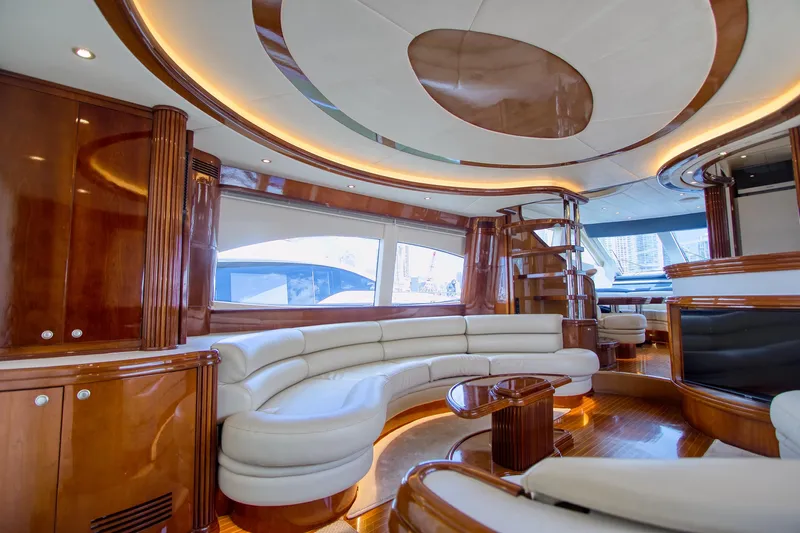 Julia Too Yacht Photos Pics Luxurious interior of 2002 Azimut 70 Sea Jet yacht with elegant wood and leather furnishings.