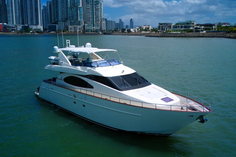 Julia Too Yacht Photos Pics Luxury 2002 Azimut 70 Sea Jet yacht cruising near urban skyline.