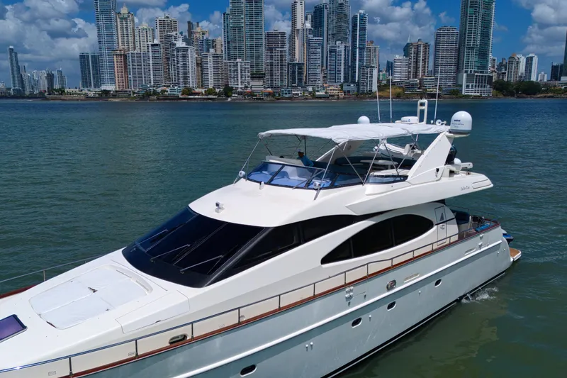 Julia Too Yacht Photos Pics Luxury 2002 Azimut 70 Sea Jet yacht cruising near city skyline.