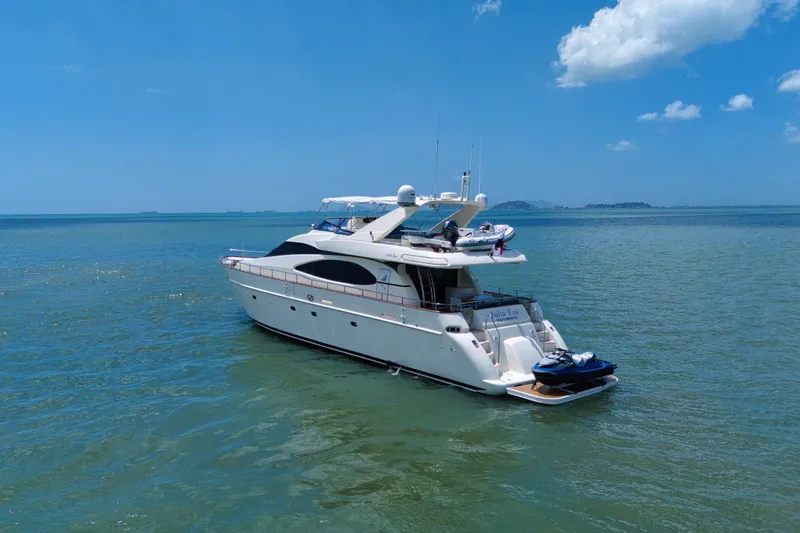 Julia Too Yacht Photos Pics Luxury 2002 Azimut 70 Sea Jet yacht on calm blue waters under clear sky.
