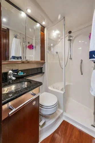  Yacht Photos Pics Luxurious bathroom in 2005 Sea Ray 52 Sedan Bridge yacht with modern fixtures.