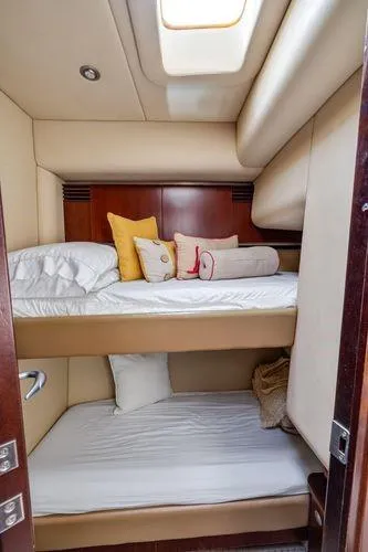  Yacht Photos Pics 2005 Sea Ray 52 Sedan Bridge cabin with cozy bunk beds and decorative pillows.