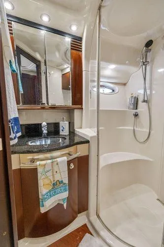  Yacht Photos Pics Luxurious bathroom in 2005 Sea Ray 52 Sedan Bridge yacht with modern fixtures.