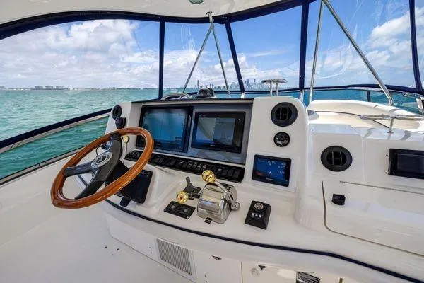  Yacht Photos Pics 2005 Sea Ray 52 Sedan Bridge helm with ocean view and modern navigation equipment.