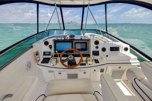  Yacht Photos Pics 2005 Sea Ray 52 Sedan Bridge helm with ocean view, featuring advanced navigation systems.