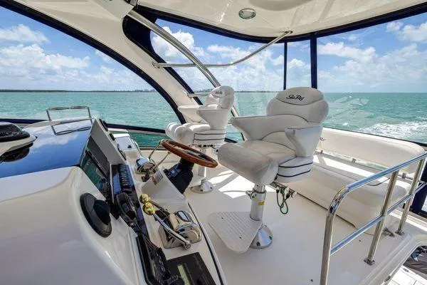  Yacht Photos Pics Luxurious 2005 Sea Ray 52 Sedan Bridge yacht interior with ocean view.