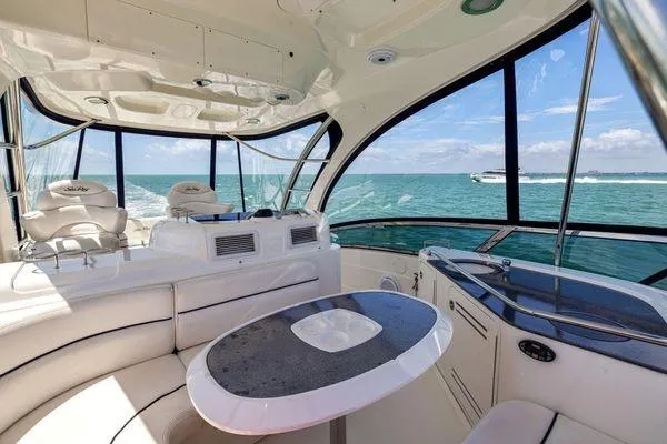  Yacht Photos Pics Luxurious 2005 Sea Ray 52 Sedan Bridge interior with ocean view.