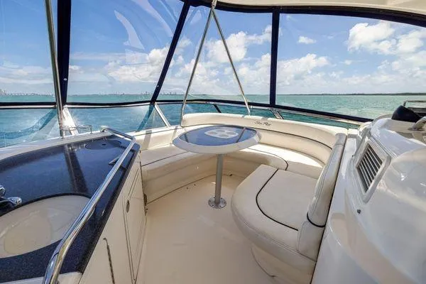  Yacht Photos Pics Luxurious interior of 2005 Sea Ray 52 Sedan Bridge yacht with ocean view.