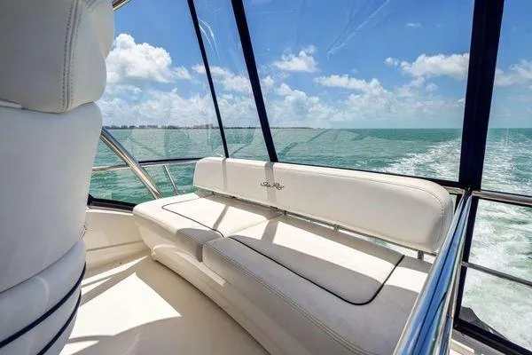  Yacht Photos Pics 2005 Sea Ray 52 Sedan Bridge interior with ocean view and white seating.