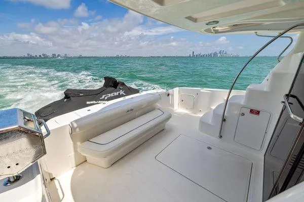  Yacht Photos Pics 2005 Sea Ray 52 Sedan Bridge yacht with spacious deck and city skyline view.
