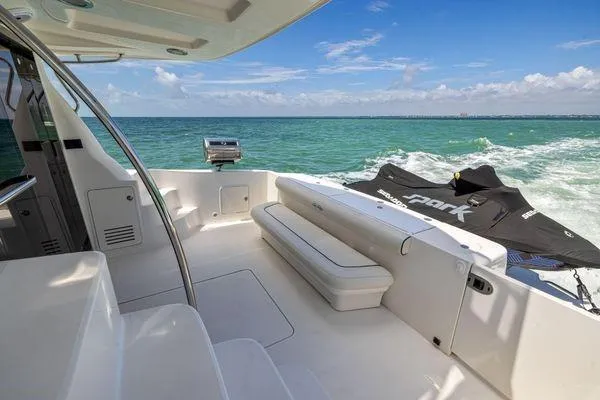  Yacht Photos Pics 2005 Sea Ray 52 Sedan Bridge yacht deck with ocean view and jet ski.