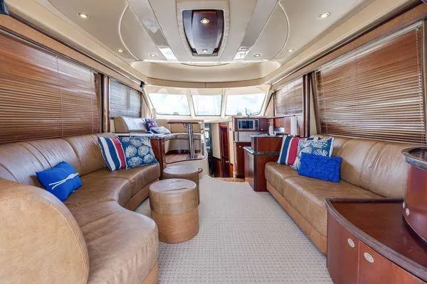  Yacht Photos Pics Luxurious interior of 2005 Sea Ray 52 Sedan Bridge yacht with leather seating and modern amenities.