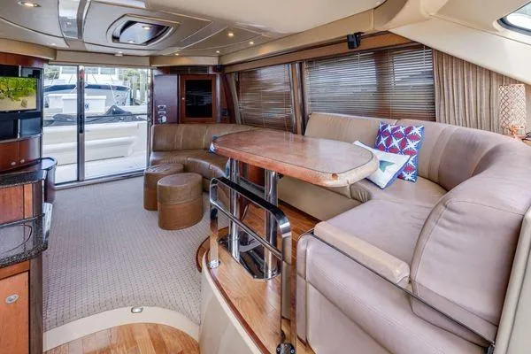  Yacht Photos Pics Luxurious interior of 2005 Sea Ray 52 Sedan Bridge yacht with plush seating and elegant decor.