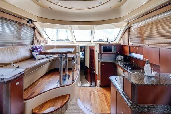  Yacht Photos Pics Luxurious interior of a 2005 Sea Ray 52 Sedan Bridge yacht with modern amenities.