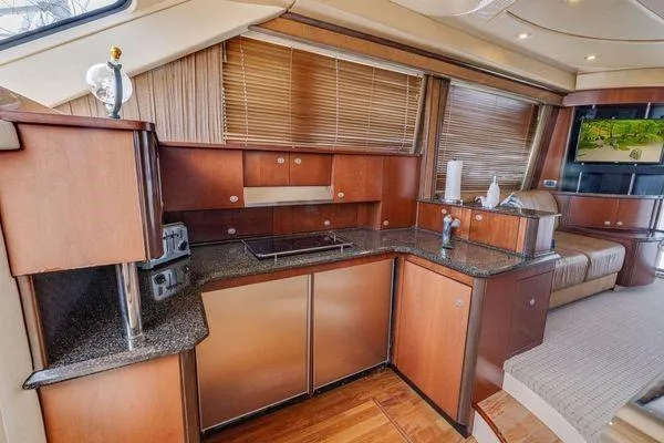  Yacht Photos Pics Luxurious kitchen interior of 2005 Sea Ray 52 Sedan Bridge yacht.