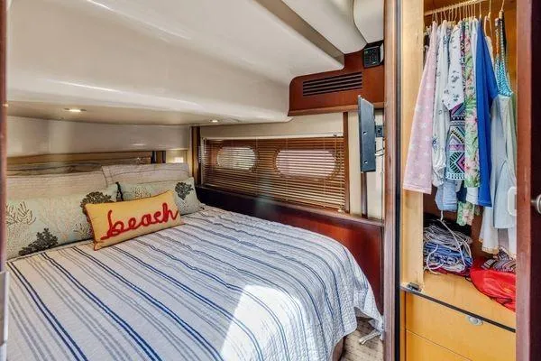  Yacht Photos Pics Luxurious bedroom in 2005 Sea Ray 52 Sedan Bridge yacht with cozy bedding and closet.