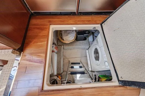  Yacht Photos Pics Hidden laundry area in 2005 Sea Ray 52 Sedan Bridge yacht.