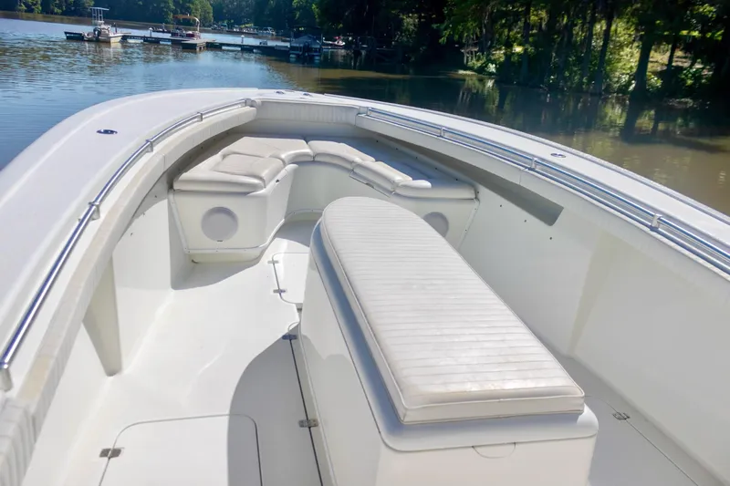  Yacht Photos Pics 2011 Yellowfin 36 Offshore boat interior with cushioned seating on a calm lake.