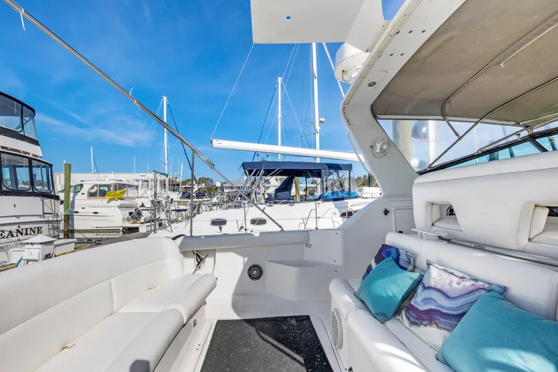  Yacht Photos Pics 1999 Tiara Yachts 4000 Express at marina, featuring spacious seating and modern design.
