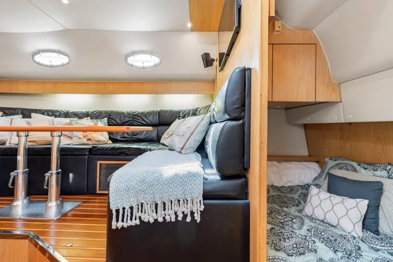  Yacht Photos Pics Interior of 1999 Tiara Yachts 4000 Express with cozy seating and sleeping area.