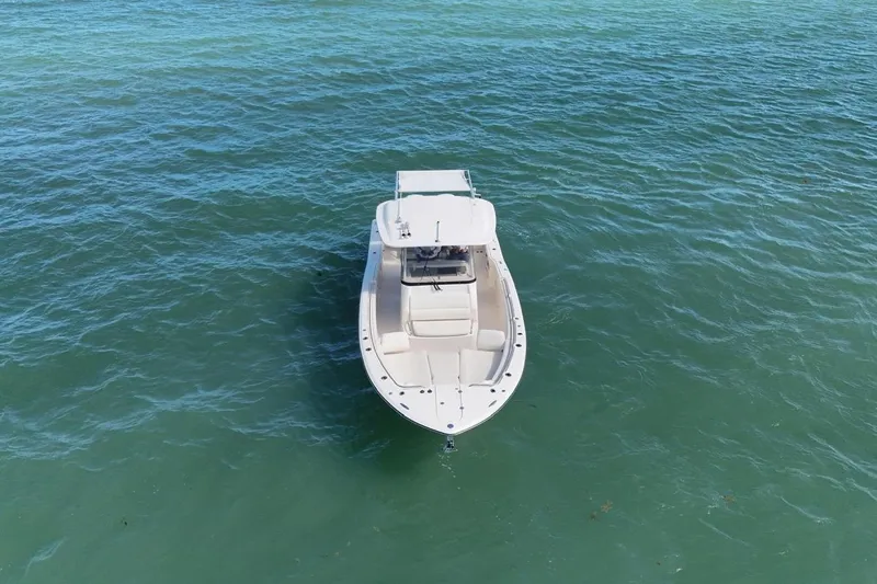  Yacht Photos Pics 2021 Grady-White Canyon 326 boat on calm blue water, aerial view.