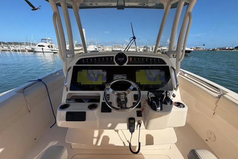  Yacht Photos Pics 2021 Grady-White Canyon 326 boat helm with dual screens, docked in marina.