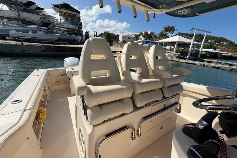  Yacht Photos Pics 2021 Grady-White Canyon 326 boat interior with luxurious seating and helm station.