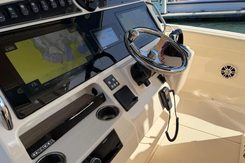  Yacht Photos Pics 2021 Grady-White Canyon 326 helm with Garmin navigation and steering wheel.