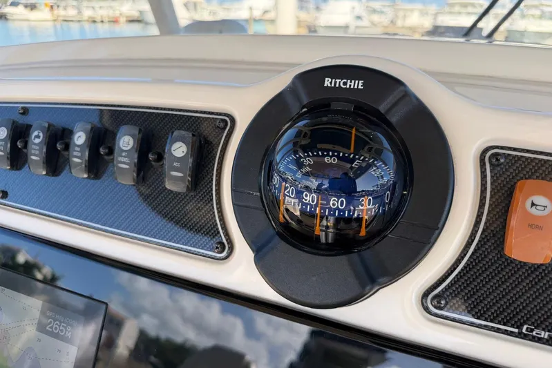  Yacht Photos Pics Dashboard of 2021 Grady-White Canyon 326 with Ritchie compass and control switches.