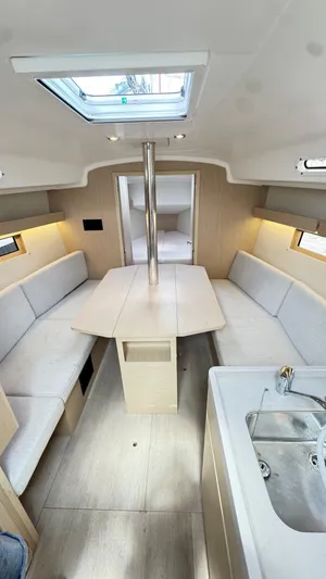  Yacht Photos Pics 2023 Beneteau Oceanis 34.1 interior with modern seating and skylight.