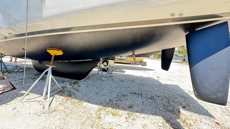  Yacht Photos Pics 2023 Beneteau Oceanis 34.1 sailboat hull and keel on dry dock.