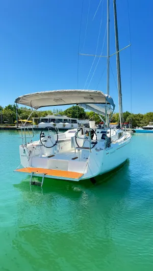  Yacht Photos Pics 2023 Beneteau Oceanis 34.1 sailboat docked in clear turquoise water.