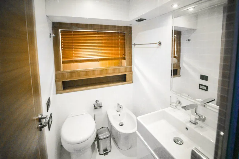  Yacht Photos Pics Luxurious bathroom in 2008 Dalla Pieta 80 yacht, featuring modern fixtures and wooden accents.