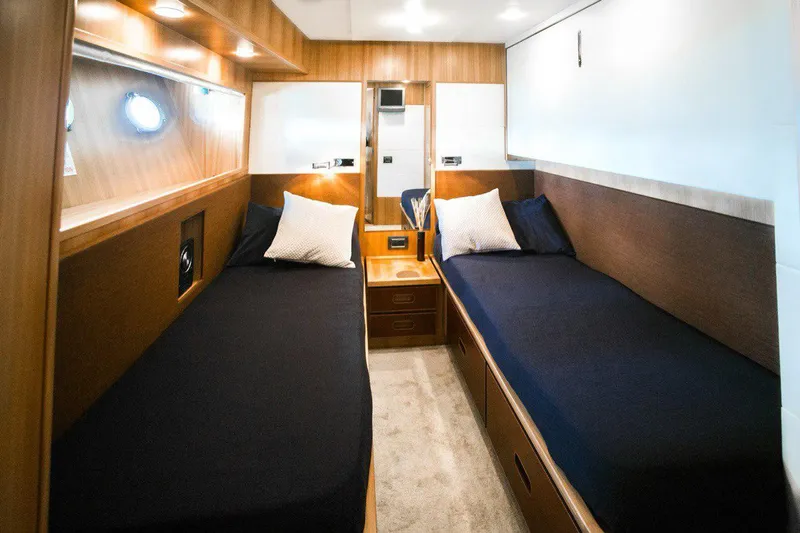  Yacht Photos Pics Luxurious 2008 Dalla Pieta 80 yacht cabin with twin beds and elegant wood finish.