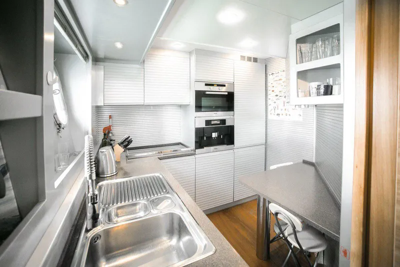  Yacht Photos Pics Modern kitchen interior on 2008 Dalla Pieta 80 yacht, featuring sleek design and stainless steel appliances.