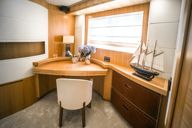  Yacht Photos Pics Luxurious 2008 Dalla Pieta 80 yacht interior with elegant wooden desk and decorative ship model.