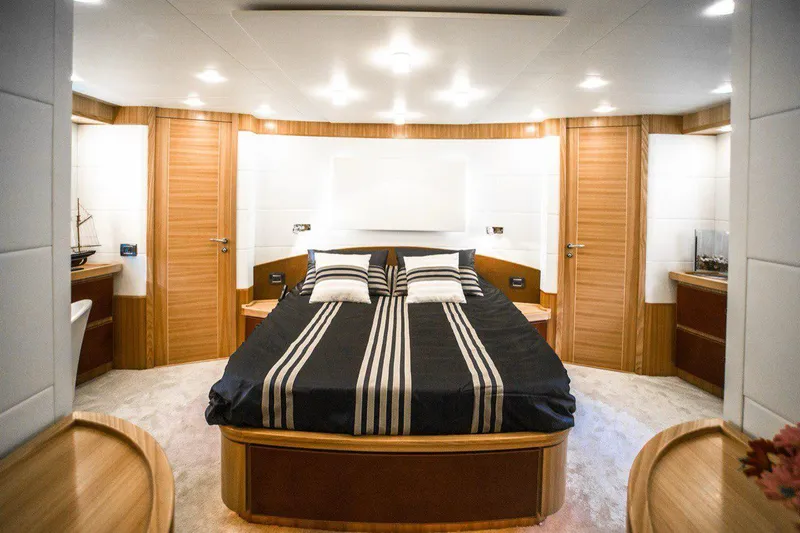  Yacht Photos Pics Luxurious bedroom interior on 2008 Dalla Pieta 80 yacht with modern design and striped bedding.