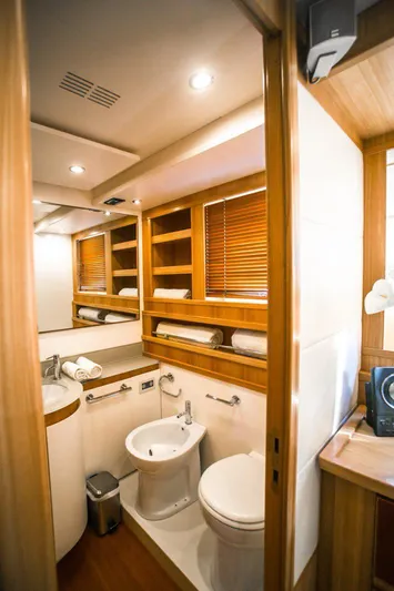  Yacht Photos Pics Luxurious bathroom interior of 2008 Dalla Pieta 80 yacht with modern fixtures and wooden accents.