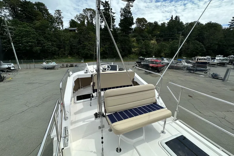  Yacht Photos Pics 2025 Ranger Tugs R-31 CB boat with seating, docked in a marina.
