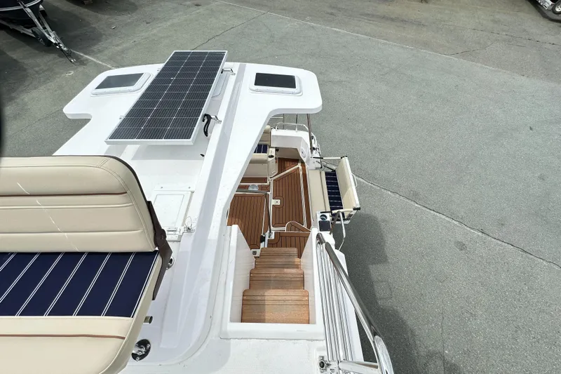  Yacht Photos Pics 2025 Ranger Tugs R-31 CB boat deck with solar panel and seating area.