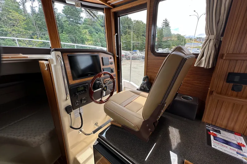  Yacht Photos Pics Interior of 2025 Ranger Tugs R-31 CB boat with helm station and captain's chair.